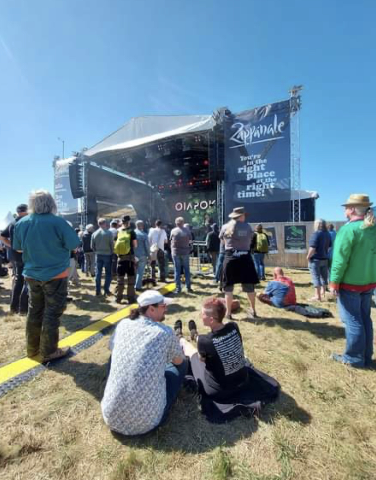 Dawn and Malcolm sitting in front of the stage at Zappanale